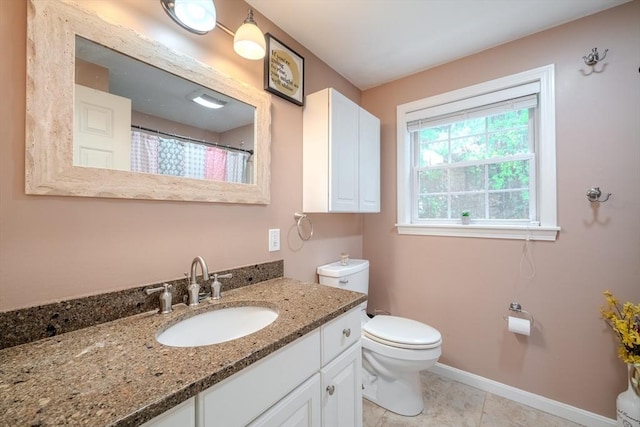 36 Westford Rd, Ayer, MA 01432 - bathroom featuring toilet, vanity, baseboards, and tile patterned flooring