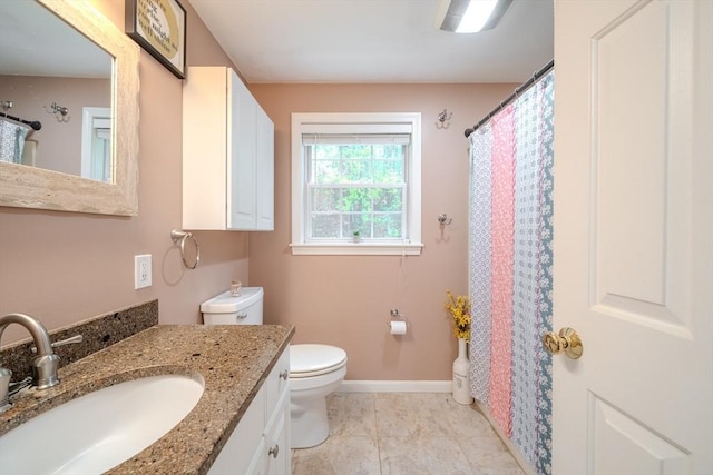 36 Westford Rd, Ayer, MA 01432 - bathroom featuring vanity, toilet, baseboards, tile patterned flooring, and curtained shower
