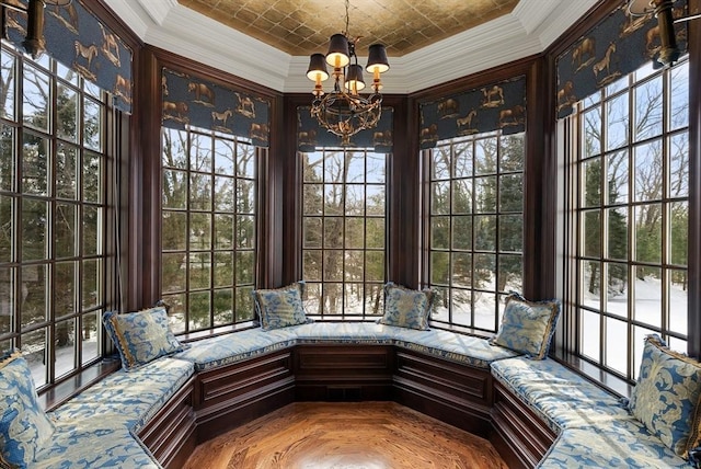 unfurnished sunroom featuring an inviting chandelier