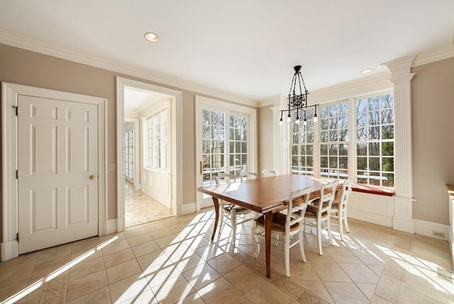 dining area with ornamental molding, light tile patterned flooring, and baseboards