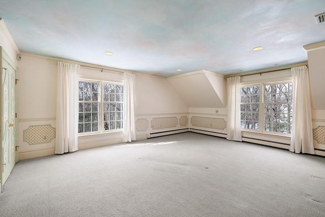 additional living space with light carpet, visible vents, and recessed lighting