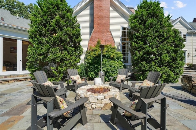 view of patio / terrace with french doors and a fire pit