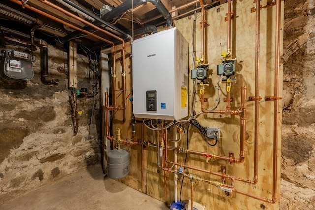 utility room featuring tankless water heater