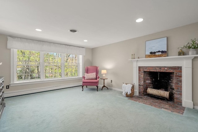 sitting room featuring a fireplace, carpet, baseboard heating, and recessed lighting