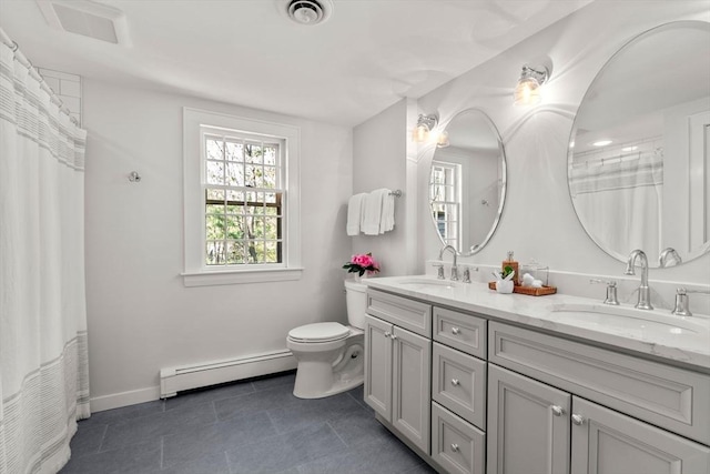 full bath with visible vents, a sink, baseboard heating, and toilet