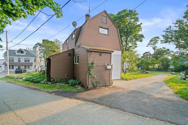 295 Rock Island Rd, Quincy, MA 02169 - view of home's exterior featuring a gambrel roof and a chimney