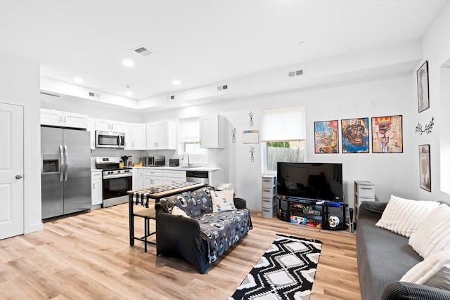 50 Frankfort St Unit 1, Fitchburg, MA 01420 - living room featuring light wood-type flooring and recessed lighting