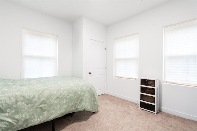50 Frankfort St Unit 1, Fitchburg, MA 01420 - bedroom with carpet flooring, multiple windows, and baseboards