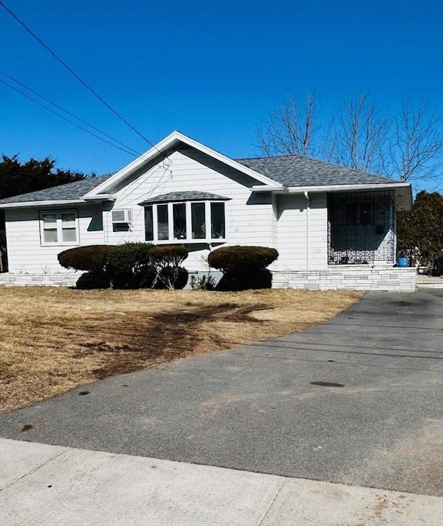 view of home's exterior featuring roof with shingles