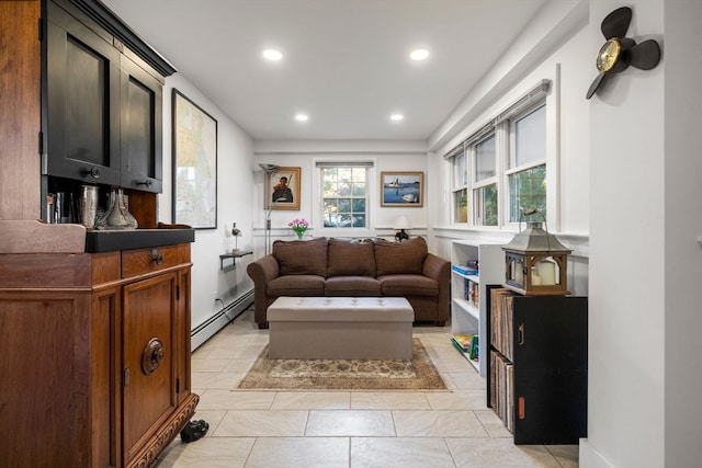 living room featuring a baseboard heating unit