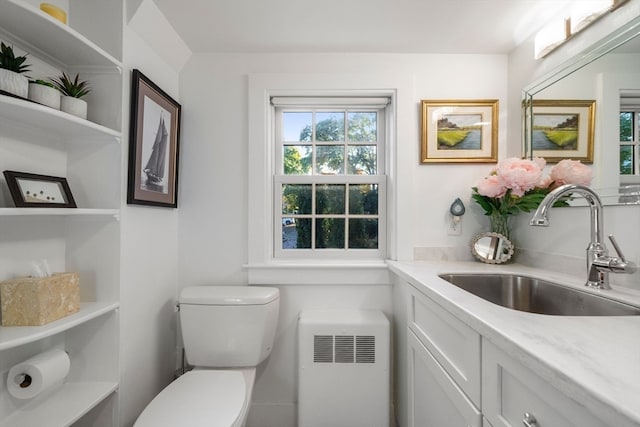 bathroom featuring toilet and vanity