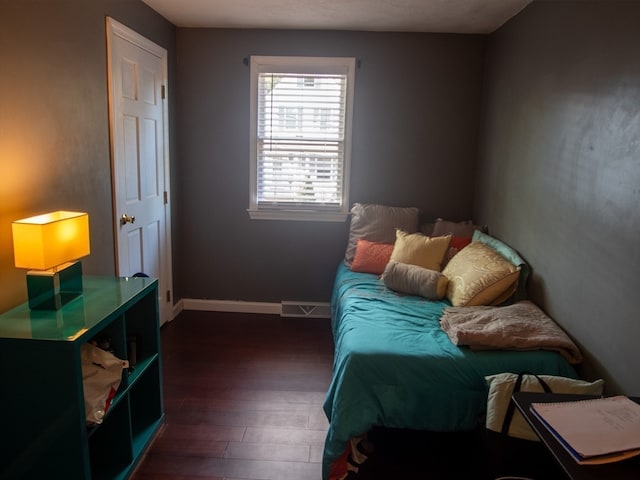 bedroom featuring dark wood-type flooring