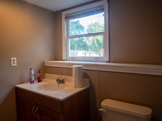 bathroom featuring vanity and toilet