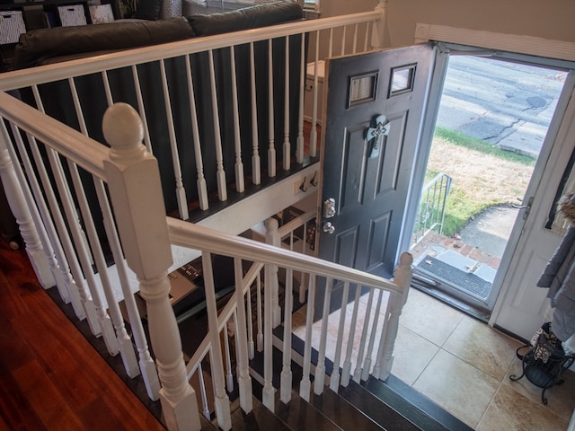 staircase with tile patterned floors