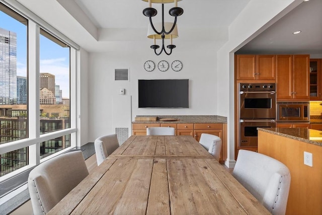 dining area featuring a chandelier