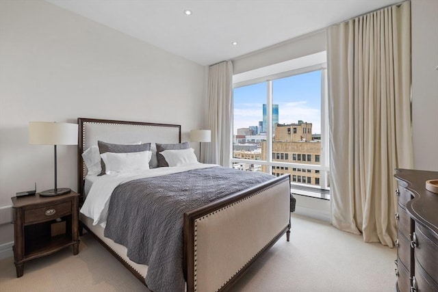 bedroom with light colored carpet