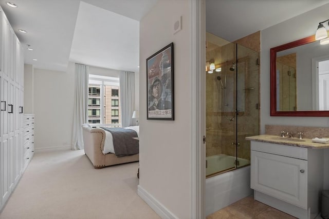 bathroom with vanity and enclosed tub / shower combo