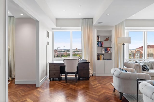 office area with built in shelves and parquet flooring