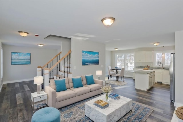 living room featuring dark hardwood / wood-style flooring and sink