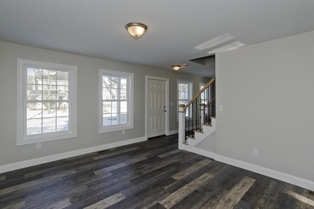 foyer entrance featuring dark hardwood / wood-style floors