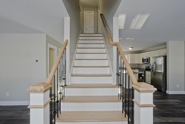 stairs with hardwood / wood-style flooring