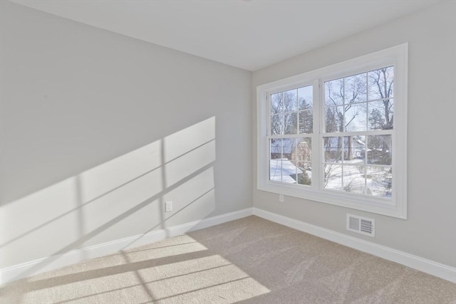 empty room featuring light carpet