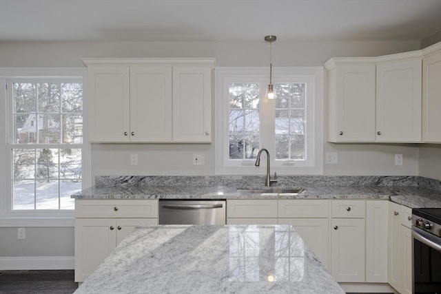 kitchen featuring white cabinetry, appliances with stainless steel finishes, and sink