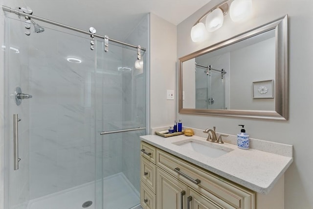 full bath with a stall shower and vanity