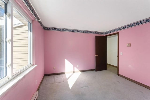 carpeted empty room featuring a healthy amount of sunlight