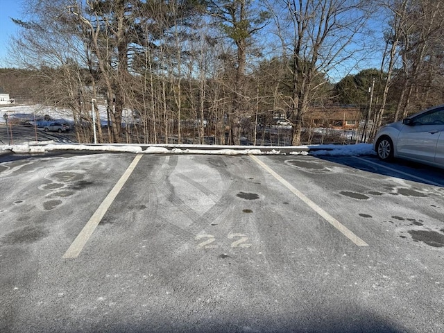 view of snow covered parking