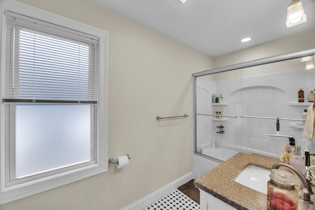 bathroom featuring recessed lighting, enclosed tub / shower combo, baseboards, and vanity