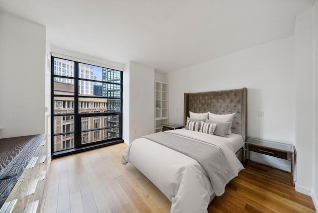 580 Washington St Unit 901, Boston, MA 02111 - bedroom featuring wood finished floors