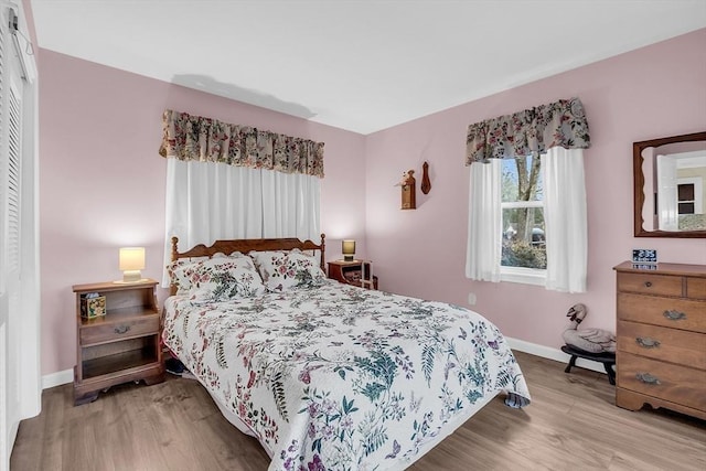 bedroom featuring light wood-type flooring