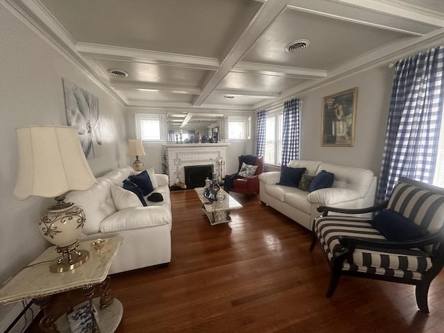 living room with coffered ceiling, a wealth of natural light, dark wood-type flooring, and ornamental molding