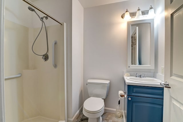 bathroom featuring walk in shower, vanity, and toilet