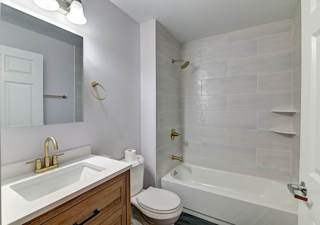 full bathroom featuring vanity, toilet, and tiled shower / bath combo