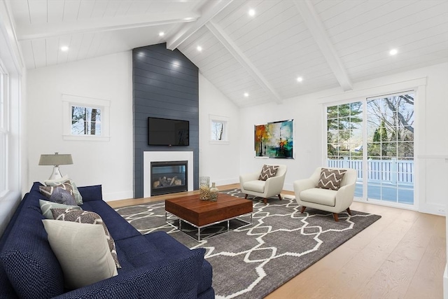 7 Bennett St, Natick, MA 01760 - living room with wood finished floors, a large fireplace, beamed ceiling, recessed lighting, and high vaulted ceiling