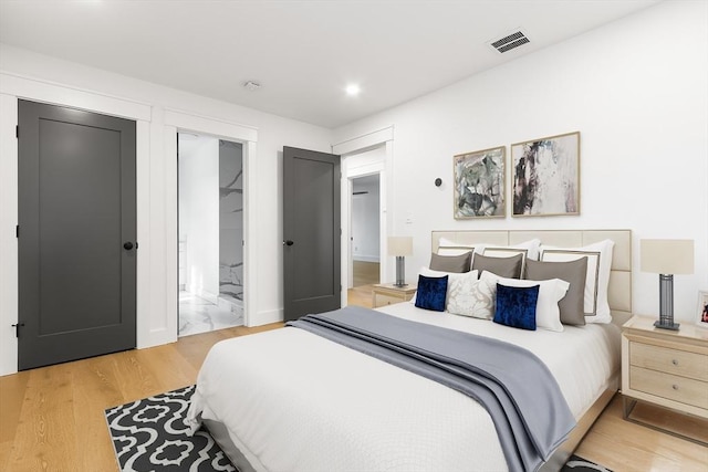 7 Bennett St, Natick, MA 01760 - bedroom featuring light wood-style flooring, ensuite bath, and recessed lighting