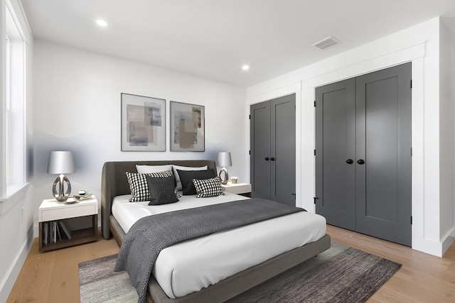 7 Bennett St, Natick, MA 01760 - bedroom featuring light wood finished floors, recessed lighting, and multiple closets