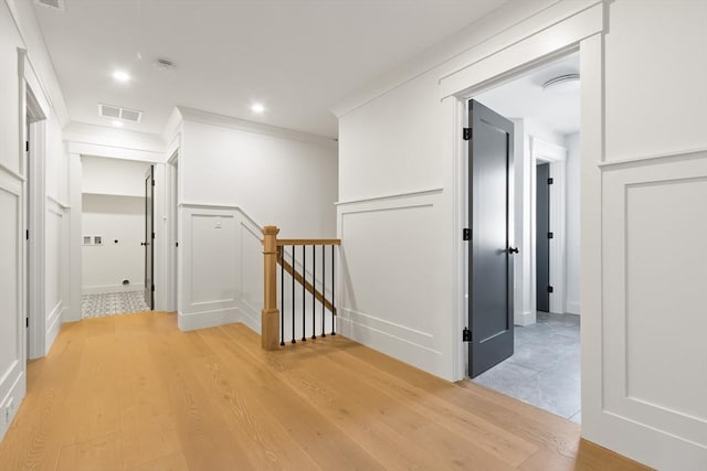 7 Bennett St, Natick, MA 01760 - hallway with an upstairs landing, ornamental molding, light wood-style flooring, and recessed lighting