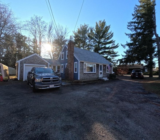 property exterior at dusk featuring a garage