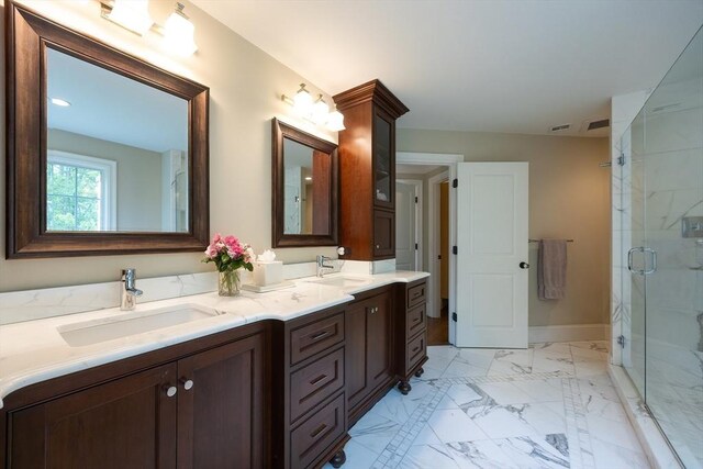 5 Copperbeech Cir, Westborough, MA 01581 - full bath with marble finish floors, double vanity, a marble finish shower, and baseboards