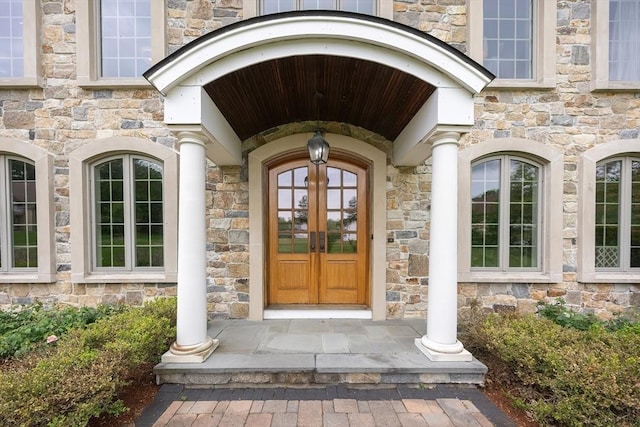 5 Copperbeech Cir, Westborough, MA 01581 - doorway to property with stone siding and french doors