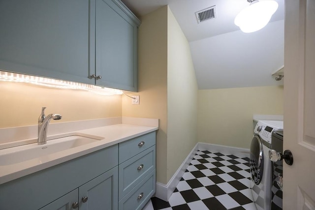 5 Copperbeech Cir, Westborough, MA 01581 - laundry room featuring washer and clothes dryer, cabinet space, tile patterned floors, and baseboards