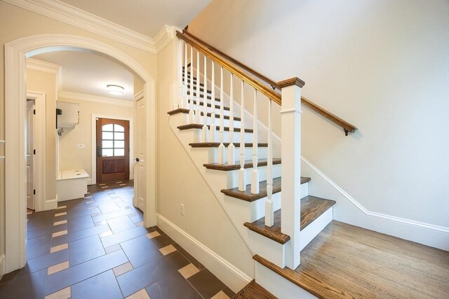 5 Copperbeech Cir, Westborough, MA 01581 - stairway with arched walkways, ornamental molding, and baseboards