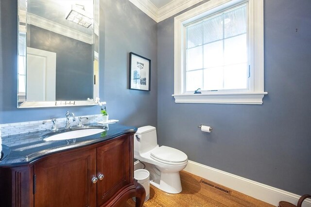5 Copperbeech Cir, Westborough, MA 01581 - half bath with baseboards, vanity, toilet, wood finished floors, and crown molding