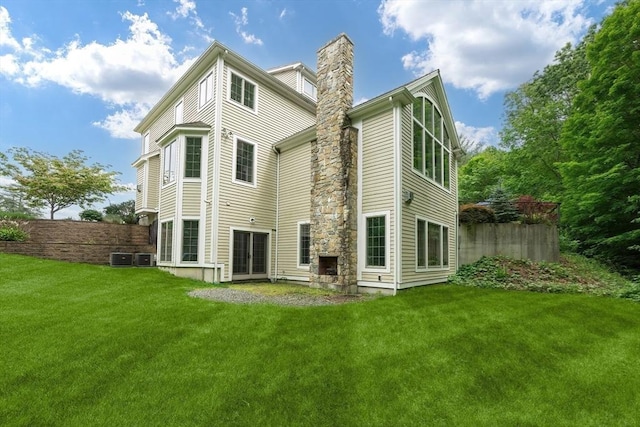 5 Copperbeech Cir, Westborough, MA 01581 - rear view of house featuring a chimney and central AC