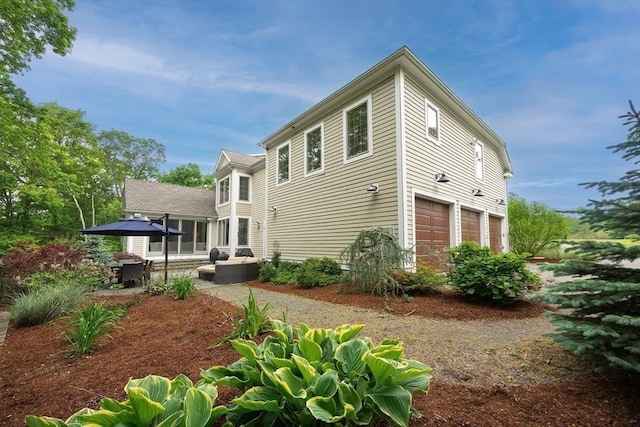 5 Copperbeech Cir, Westborough, MA 01581 - rear view of house featuring a garage and a patio area