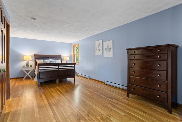 52 Diana Dr, Marlborough, MA 01752 - bedroom with baseboard heating and light wood-style floors