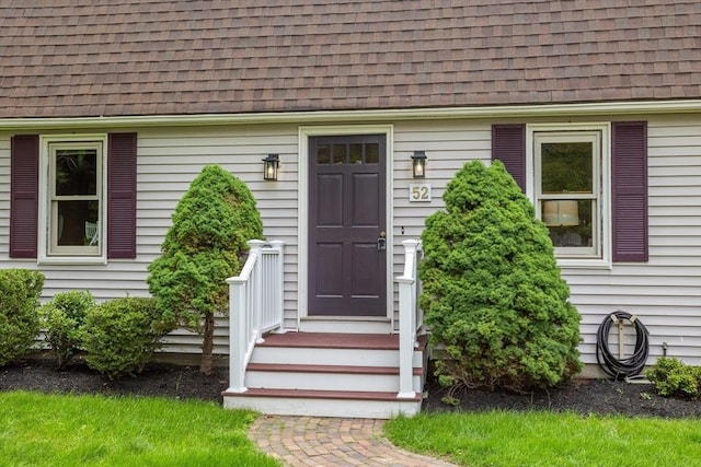 52 Diana Dr, Marlborough, MA 01752 - view of exterior entry with a shingled roof